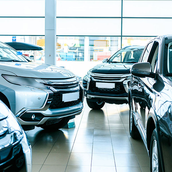 Three SUVs in a dealership room featured